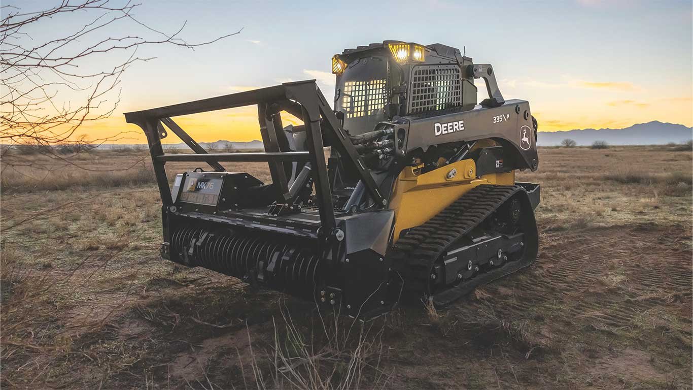 The John Deere 335 P-Tier with the MK76 mulching head in the desert